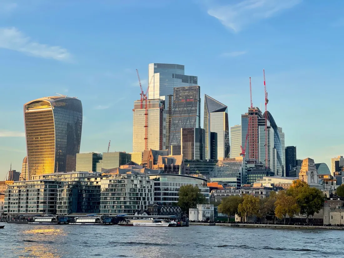 City of London office towers beside the Thames, illustrating how to buy a commercial property in the UK as a foreign company