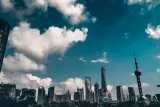 Shanghai skyline under a cloudy sky, illustrating the question has China's AI bubble burst after the STAR50 sell-off