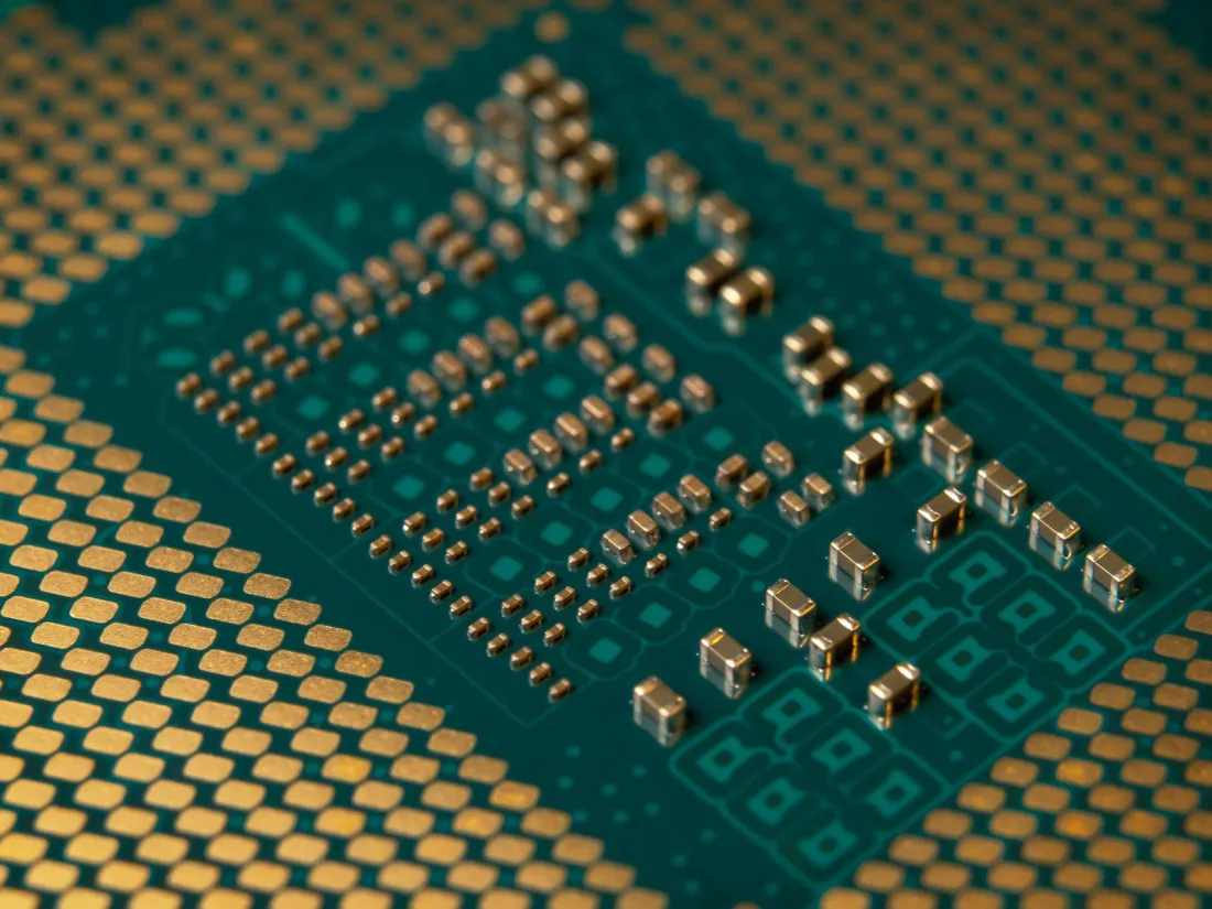 Close-up of a microprocessor and circuit components, illustrating the Chinese AI chip stocks behind the question has China's AI bubble burst
