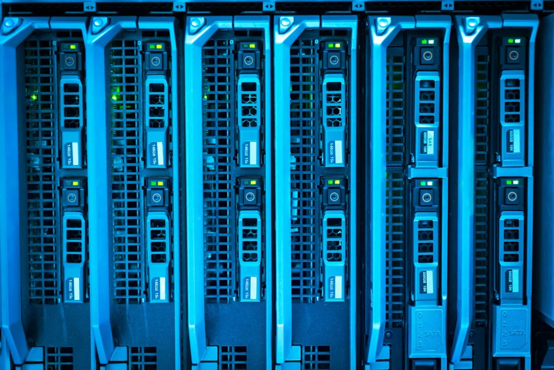 Rows of blue-lit server racks in a data centre, illustrating export controls and the China AI bubble