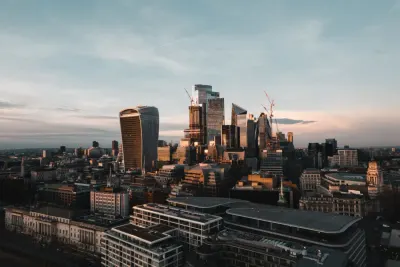 Aerial view of the City of London skyscrapers at sunset, illustrating the FCA rules on targeted support