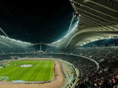 Floodlit football stadium at night, illustrating the sports event contracts at the centre of the Kalshi Utah lawsuit