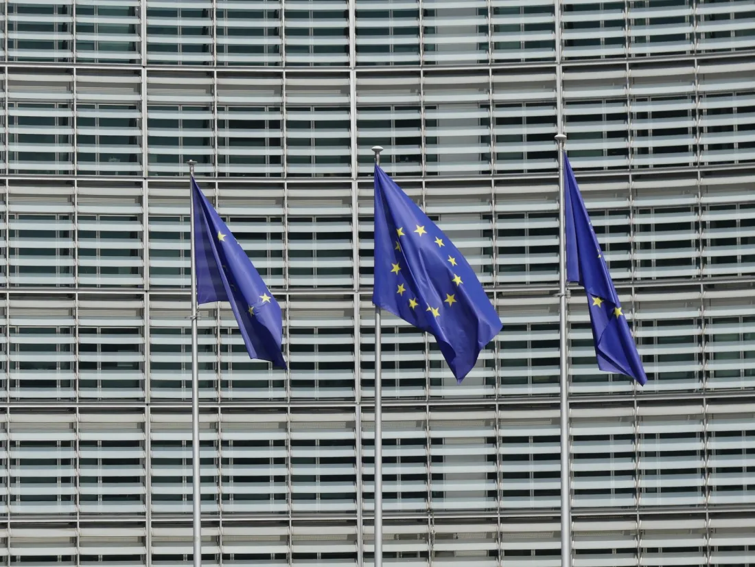European Union flags outside the Berlaymont in Brussels, context for the largest GDPR fines imposed on Big Tech