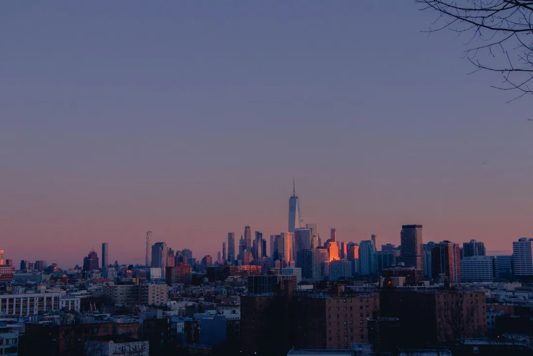 Lower Manhattan skyline at dusk, illustrating Corporate INTL legal and business news from the world's financial centres