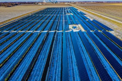 Aerial view of rows of solar panels at a large solar farm, illustrating US renewable energy data centre expansion