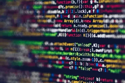 A close-up of colourful lines of computer code on a screen, illustrating data security practices during the pandemic