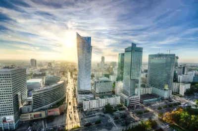 Aerial sunrise view of a modern Eastern European city skyline, reflecting concerns over trade credit risk