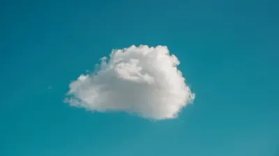 A single white cloud floating in a clear blue sky, symbolising cloud data security
