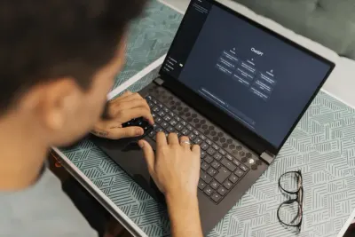 Person typing on a laptop with a ChatGPT screen open, reflecting workers' views on generative AI