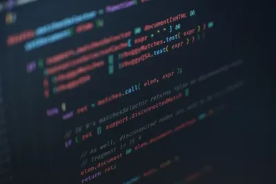 Close-up of coloured code on a dark screen, illustrating rising ransomware attacks