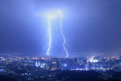 Lightning strikes illuminating a city skyline at night, representing the need for strategic flexibility