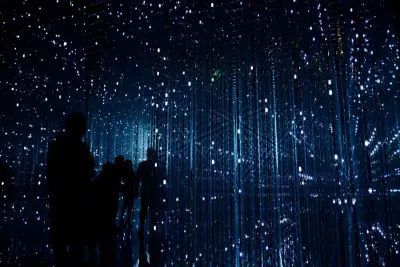 Silhouetted figures walking through a dark tunnel of glittering lights, evoking digital disruption